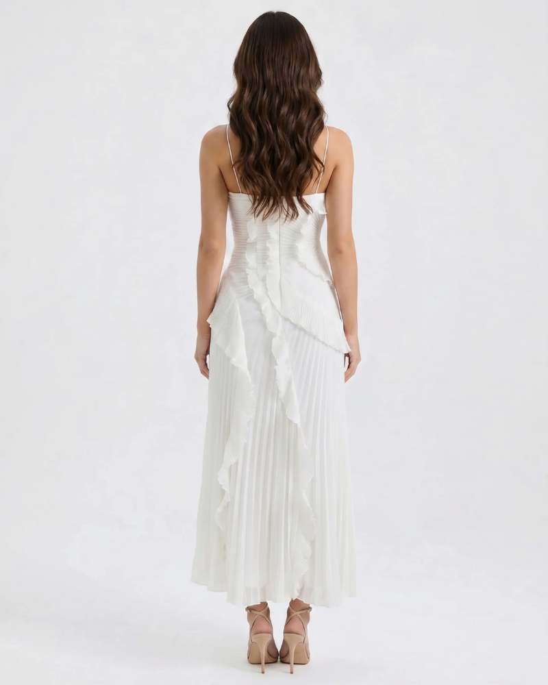 Back view of white ruffle maxi dress showing slim straps, fitted bodice and pleated skirt