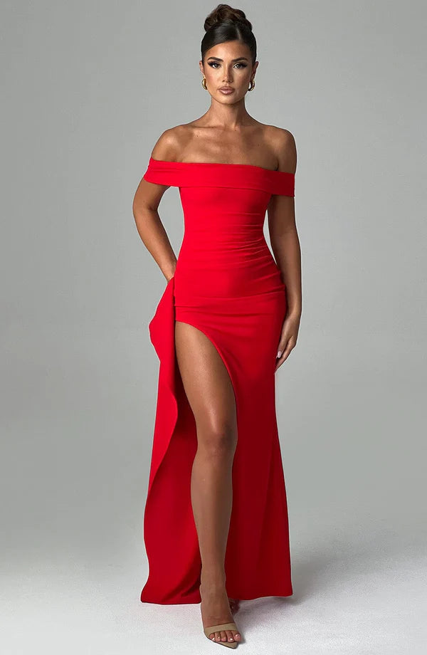 Front view red ruched maxi dress, off-shoulder neckline and high leg slit, floor-length silhouette