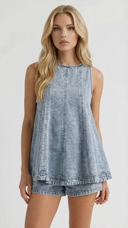 Front mid-length view of sleeveless light wash denim top with round neck and matching shorts