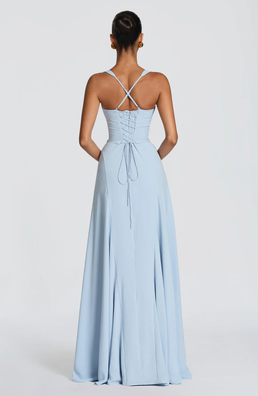 Back view of light blue corset maxi dress with lace-up bodice and crisscross adjustable straps
