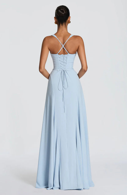 Back view of light blue corset maxi dress with lace-up bodice and crisscross adjustable straps