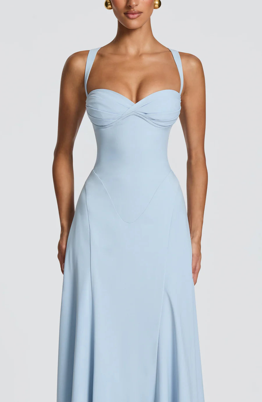 Close-up of light blue corset maxi dress showing ruched sweetheart bust, seamed bodice, and straps