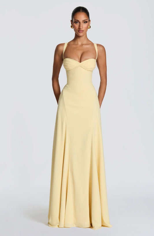 Pale yellow corset maxi dress with sweetheart neckline, wide straps, and floor-length skirt front view