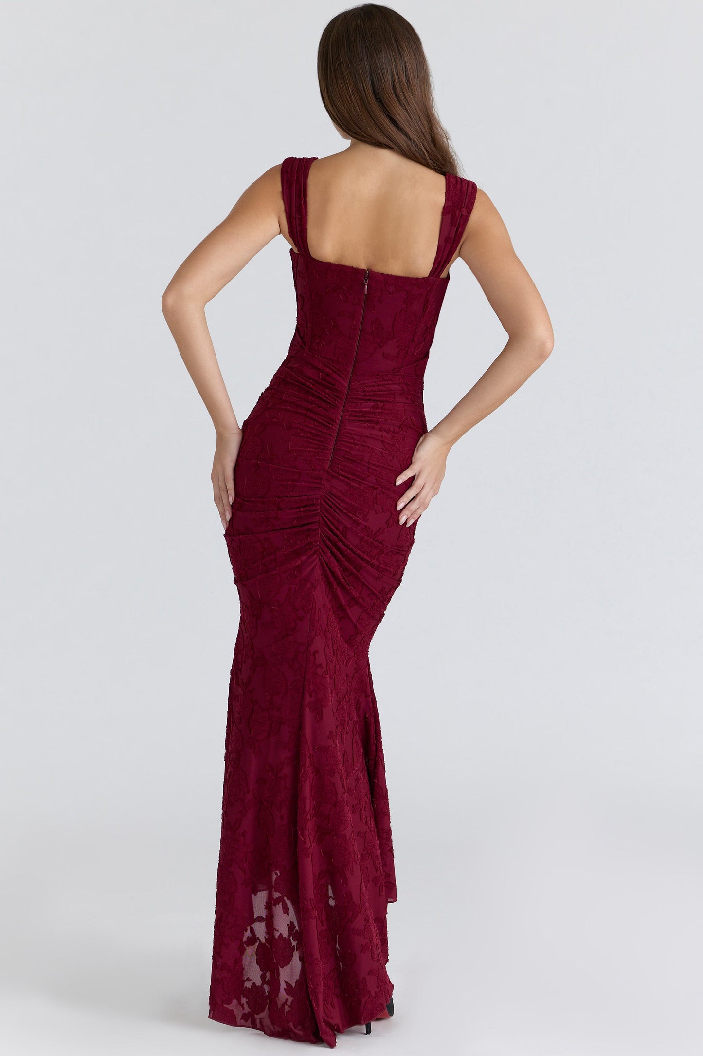 Back view burgundy corset midi dress showing square back, center zipper, and ruched detailing