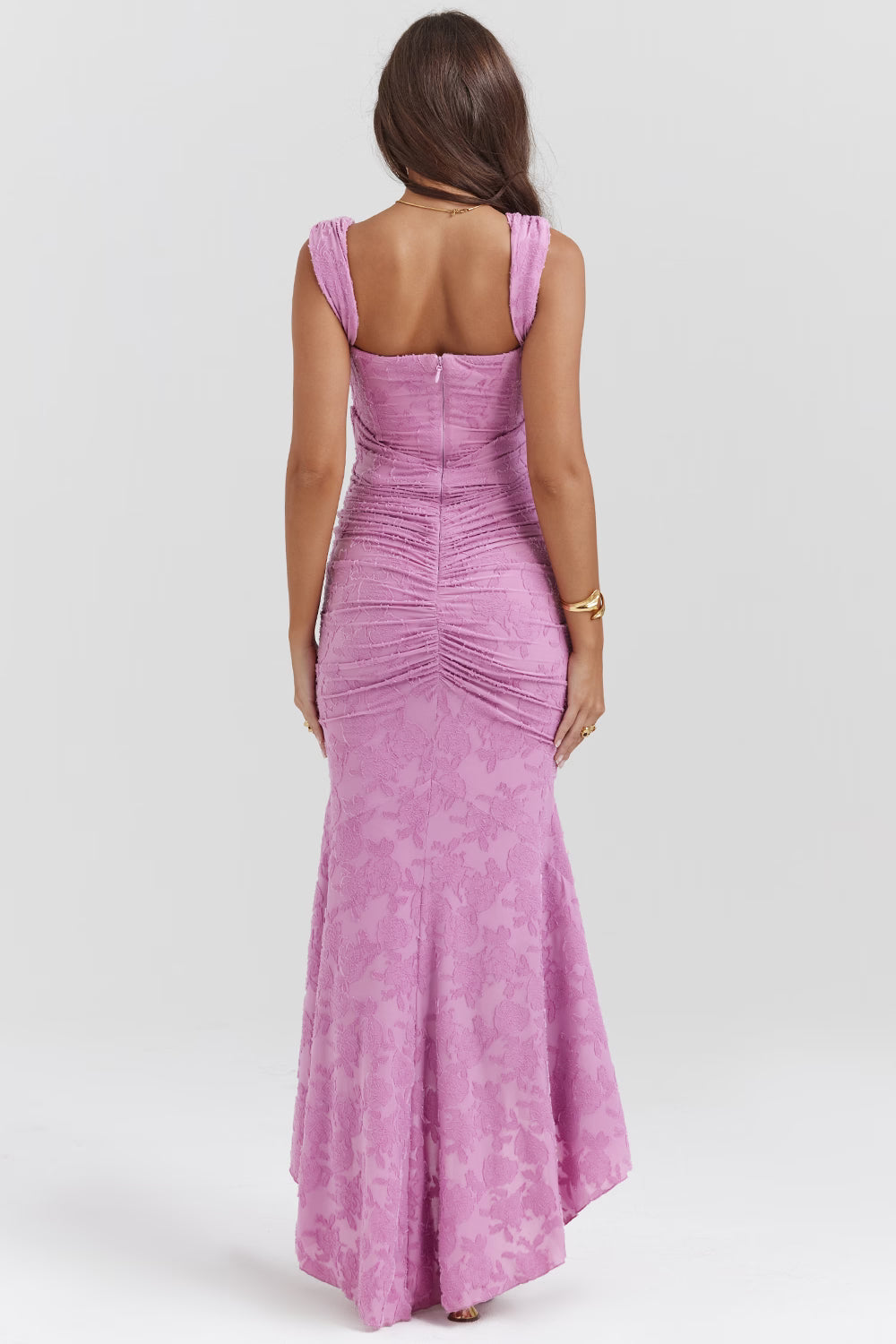 Back view of pink corset midi dress with centered zipper, ruched seam detail and wide straps