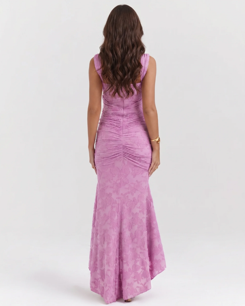 Back view of pink corset midi dress showing fitted silhouette, ruched back detail and high-low hemline