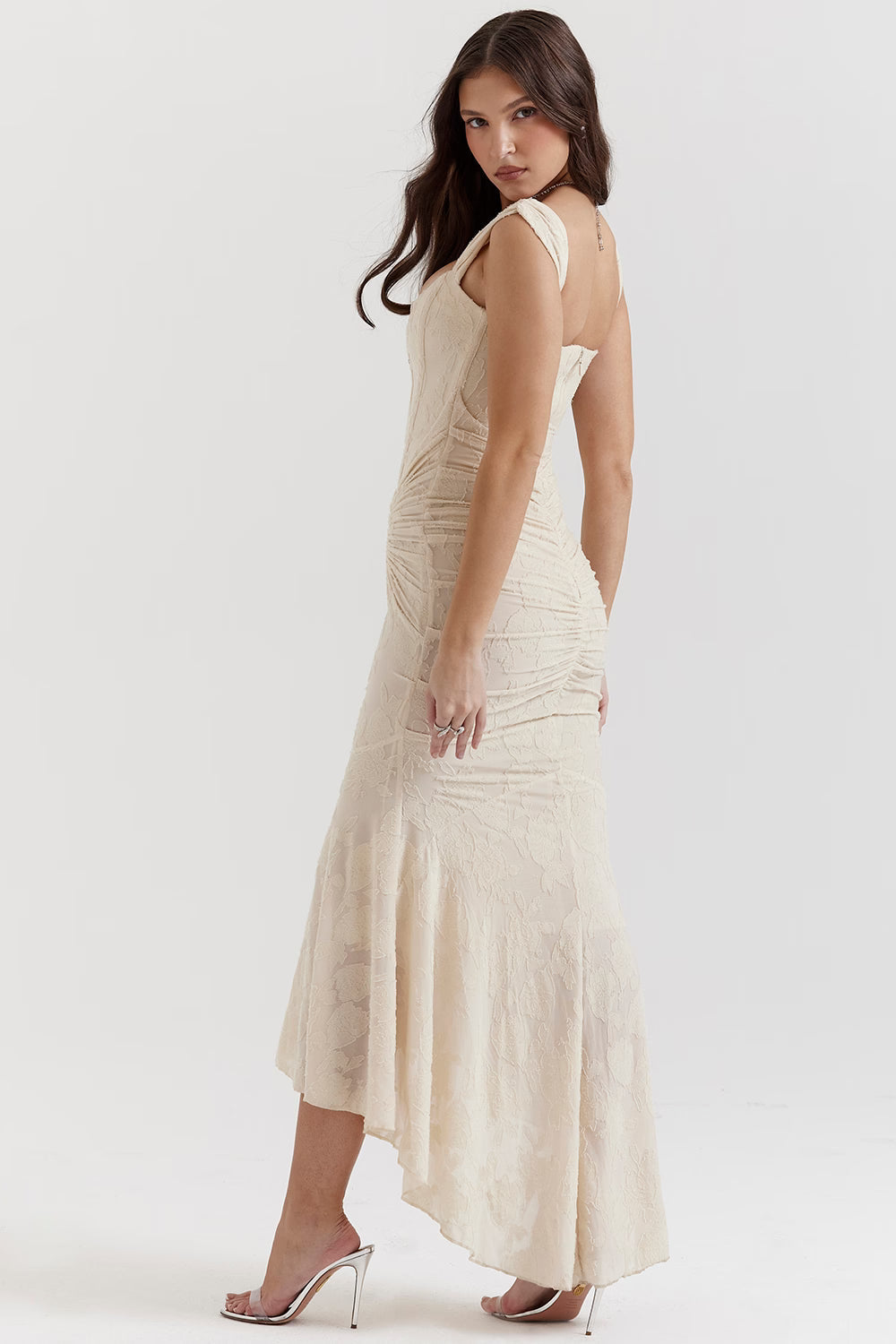 Back three-quarter view white corset midi dress with low back, wide straps and high-low skirt hem