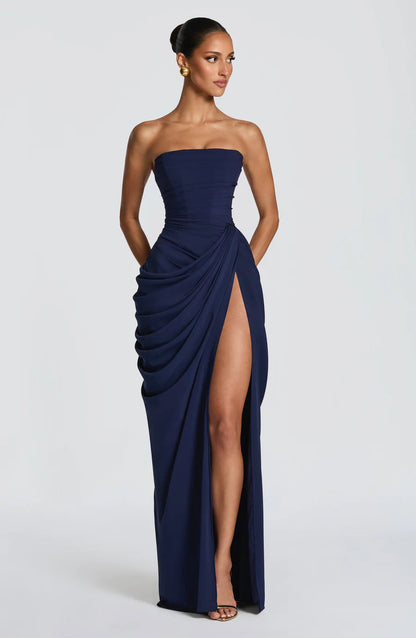 Navy strapless ruched maxi dress with draped skirt and high thigh slit, front full-length view