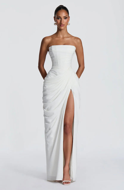 Strapless white ruched maxi dress with wrap skirt and high thigh slit, front full-length view