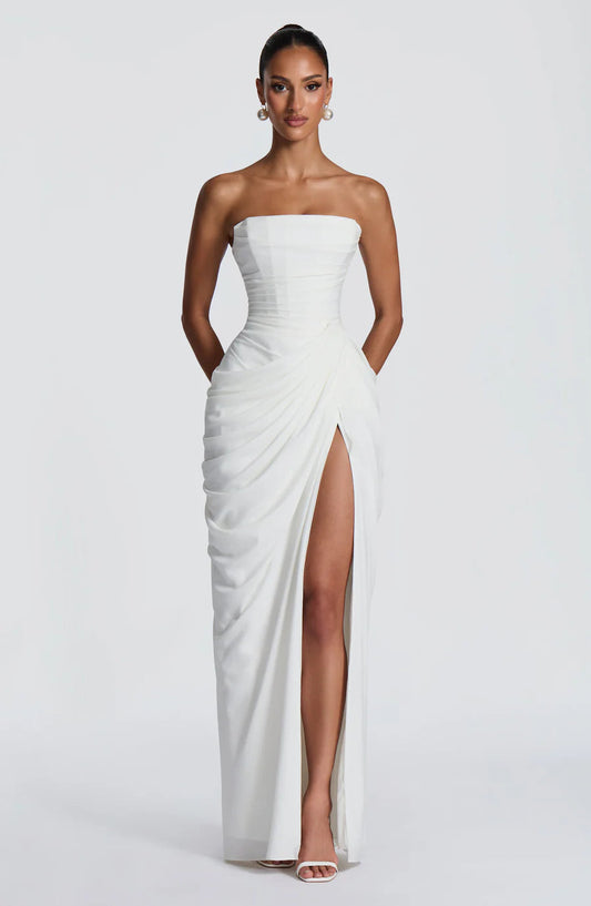 Strapless white ruched maxi dress with wrap skirt and high thigh slit, front full-length view