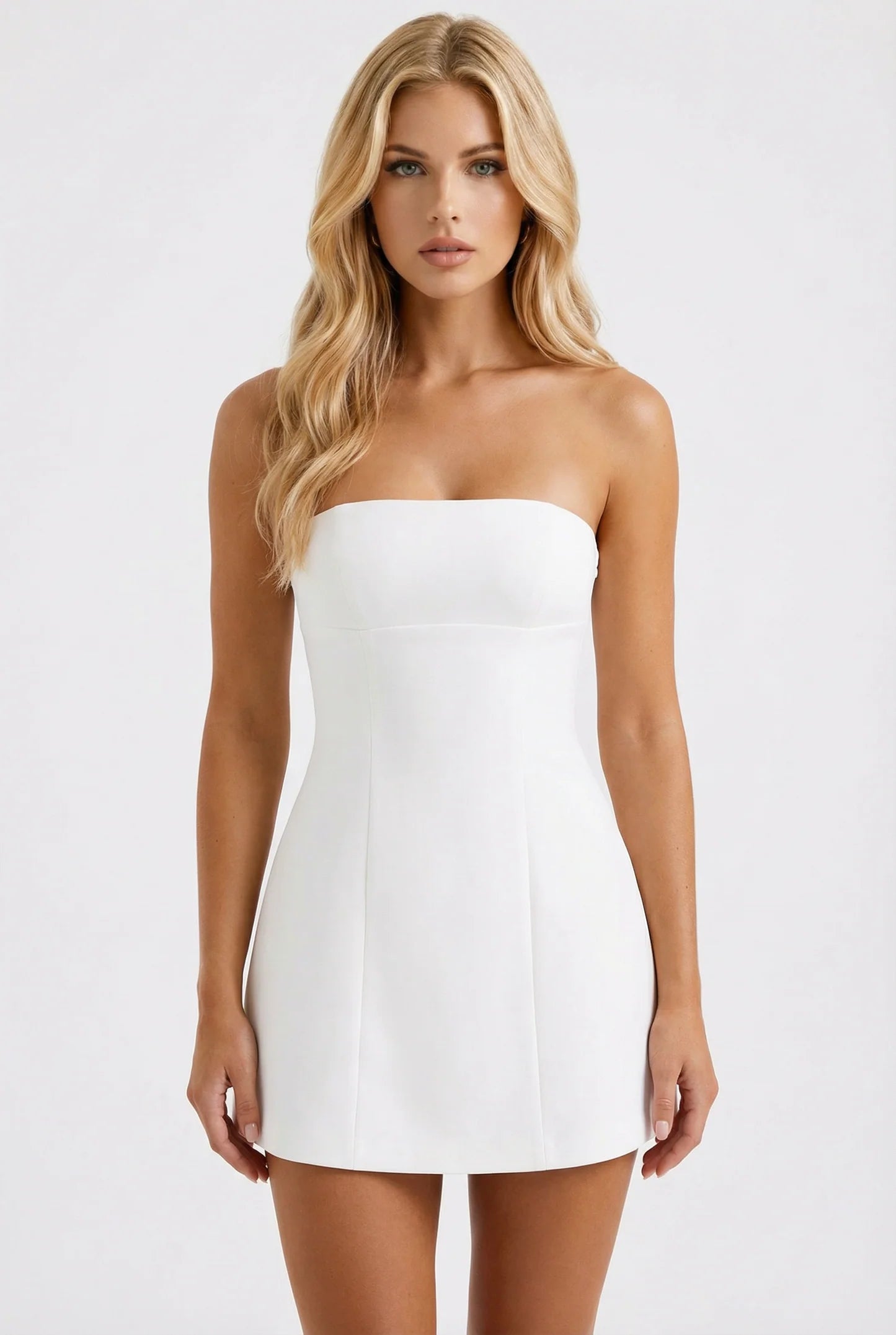 Front view of white strapless mini dress with fitted bodice and slight A-line skirt