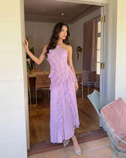 Side view of lavender ruffle maxi dress with pleated skirt and asymmetrical layered bodice