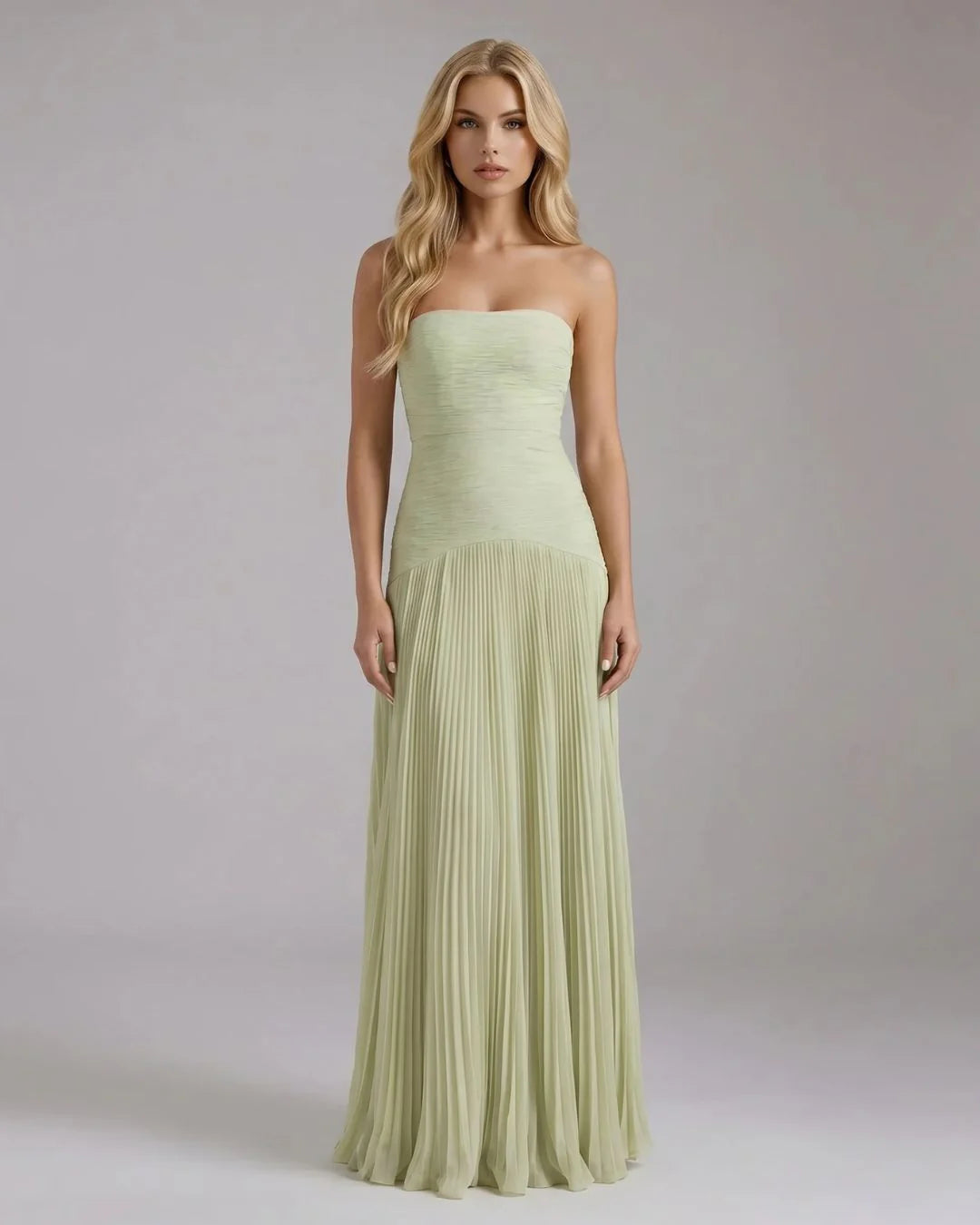 Sage green strapless maxi dress with ruched bodice and pleated chiffon skirt, front view