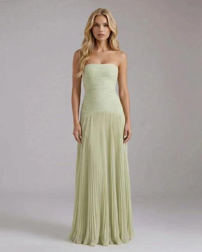 Sage green strapless maxi dress with ruched bodice and pleated chiffon skirt, front view