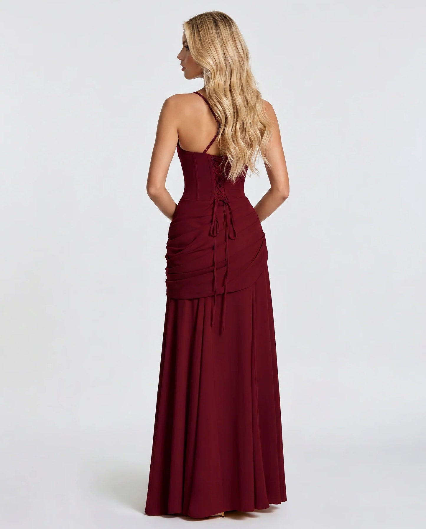 Back view of burgundy ruched maxi dress with lace-up corset back and thin shoulder straps
