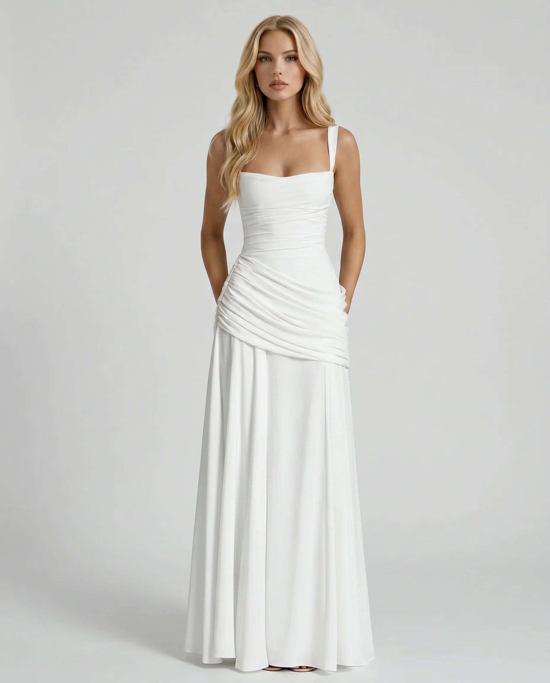 Front view white maxi dress showing draped ruching at hips and flared skirt