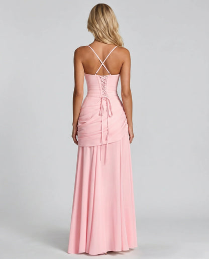 Back view of pink ruched maxi dress with crisscross straps and lace-up corset back detail