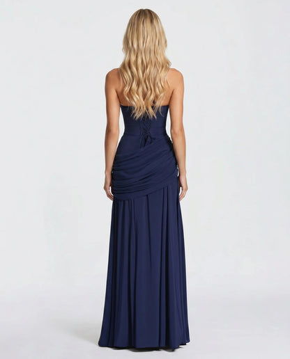 Back view of navy ruched maxi dress showing lace-up corset back and draped ruching