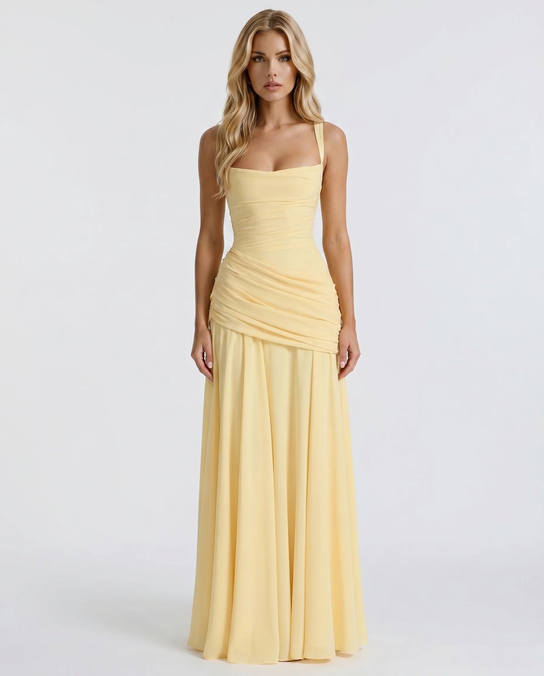 Front view of yellow ruched maxi dress with square neckline, fitted bodice, and flowing skirt