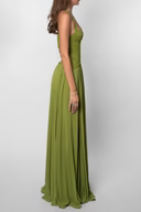 Studio side view of olive green corset maxi dress showing fitted waist and draped hem