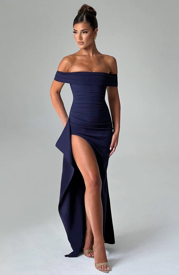 Navy off-shoulder ruched maxi dress with thigh-high slit and draped side panel, front 3/4 view