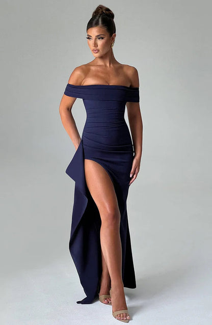 Navy off-shoulder ruched maxi dress with thigh-high slit and draped side panel, front 3/4 view