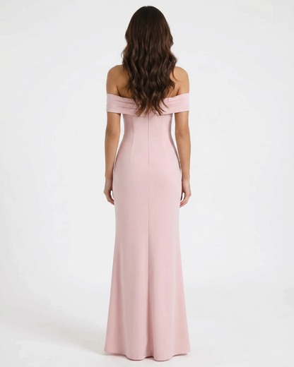 Back view of pink ruched maxi dress with off-shoulder neckline and straight floor-length hem