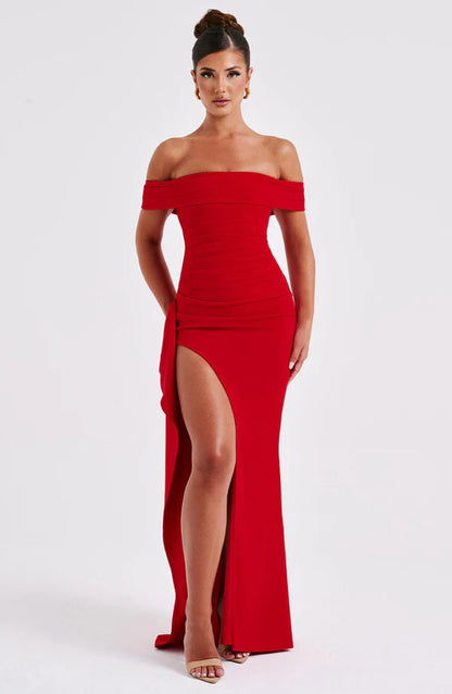 Red off-shoulder ruched maxi dress with thigh-high slit and draped side panel, front view