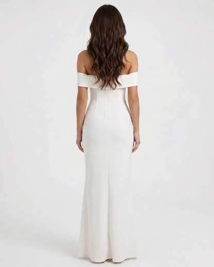 Back view of white off-shoulder maxi dress with straight neckline band and smooth fitted skirt
