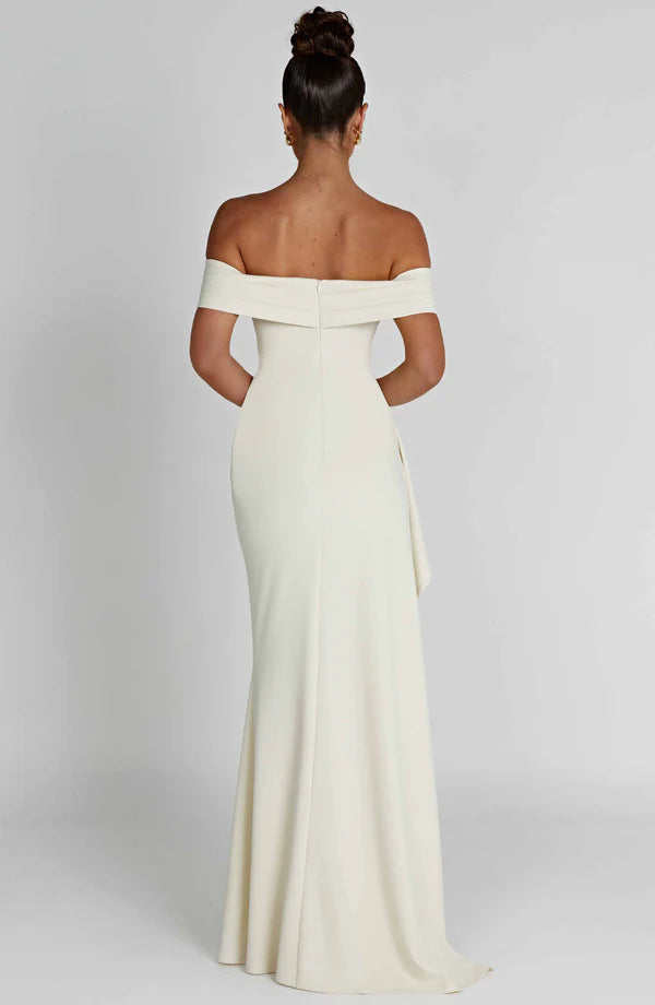 Back view of white off-shoulder ruched maxi dress with fitted silhouette and center back zipper