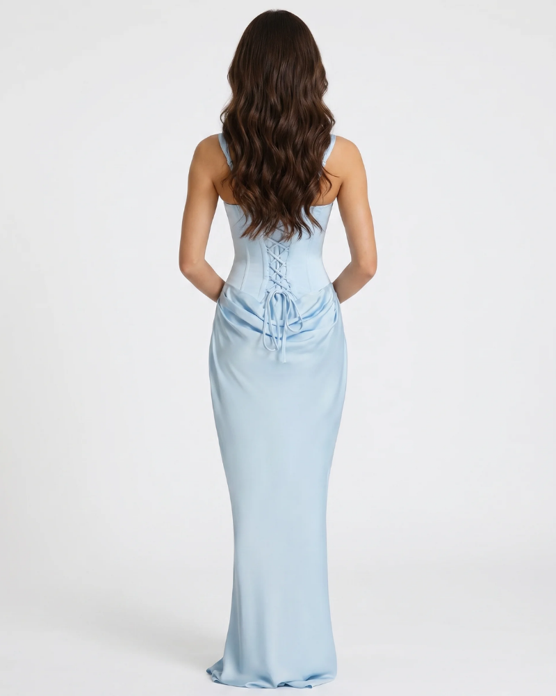 Back view of light blue maxi dress with lace-up corset back, wide straps and draped waist panel