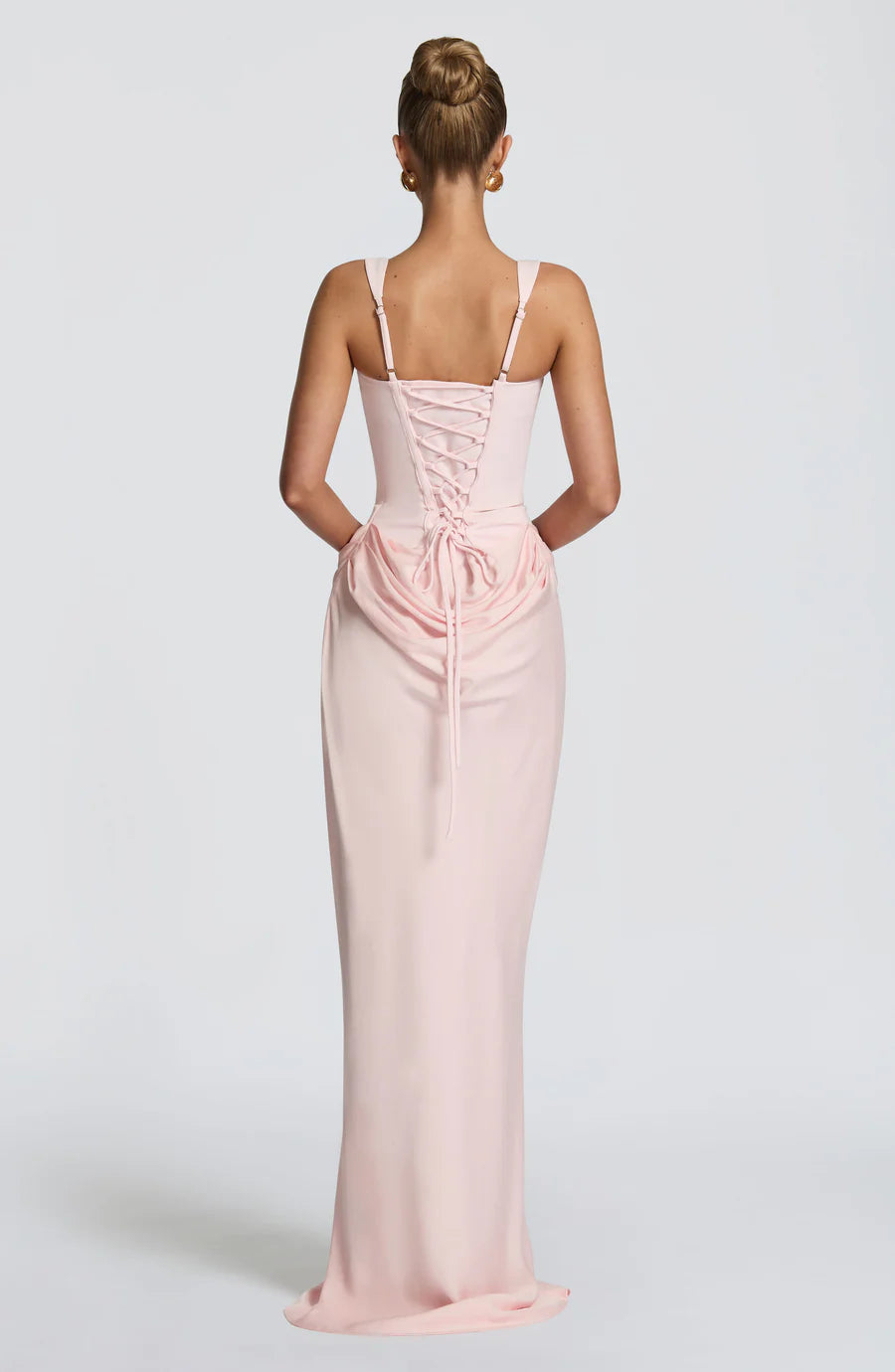 Back view blush pink draped maxi dress with lace-up corset back and wide shoulder straps
