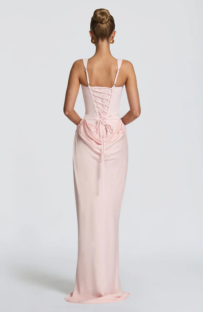 Back view blush pink draped maxi dress with lace-up corset back and wide shoulder straps