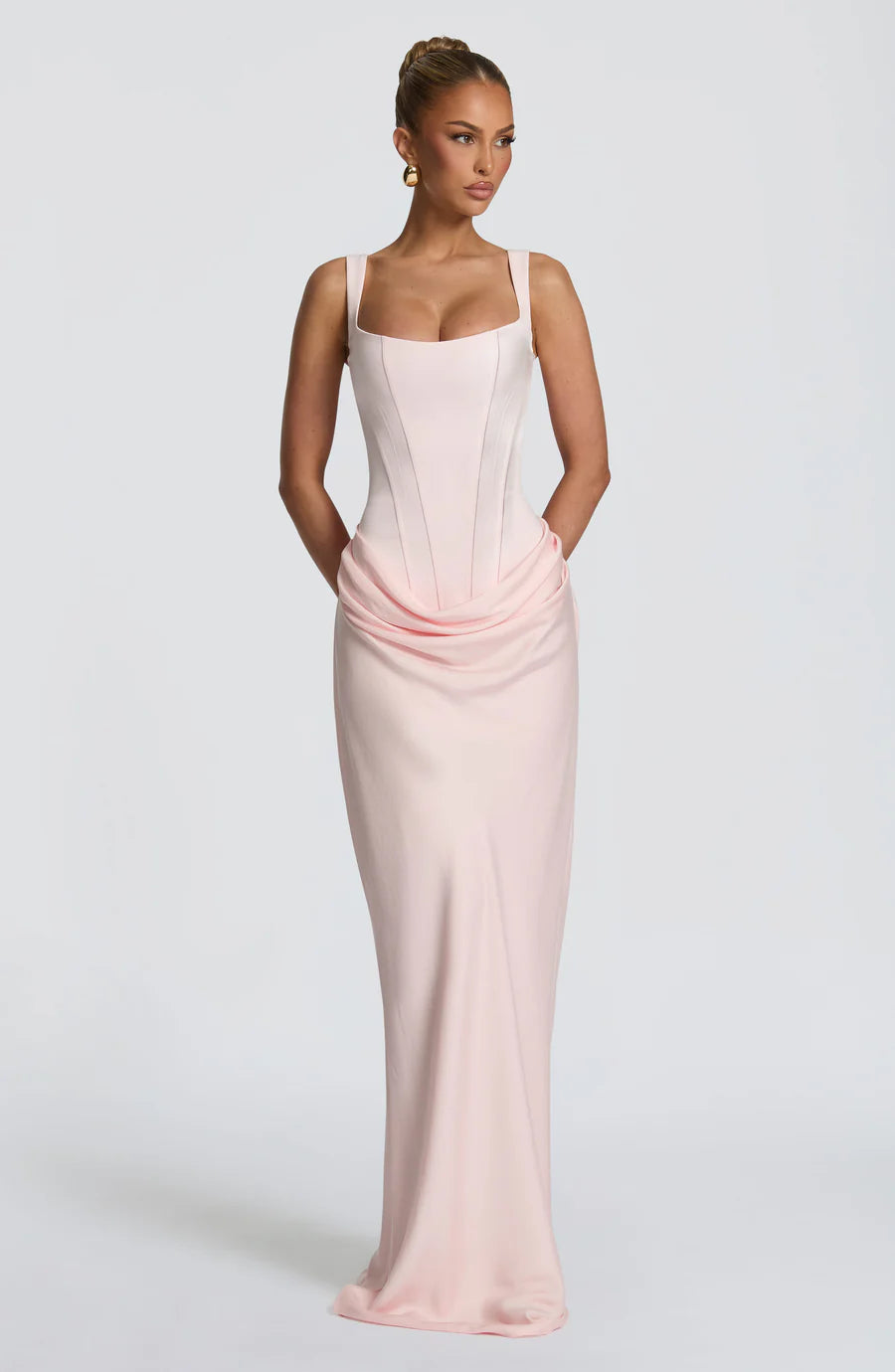 Front full-length blush pink draped maxi dress with square neckline and fitted corset bodice