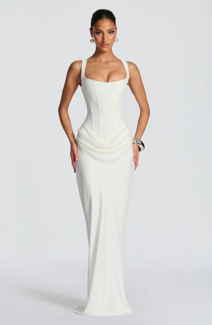 White draped maxi dress with square neckline, wide straps, corset seaming and floor-length skirt