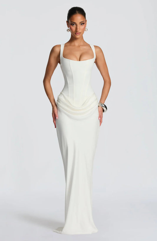 White draped maxi dress with square neckline, wide straps, corset seaming and floor-length skirt