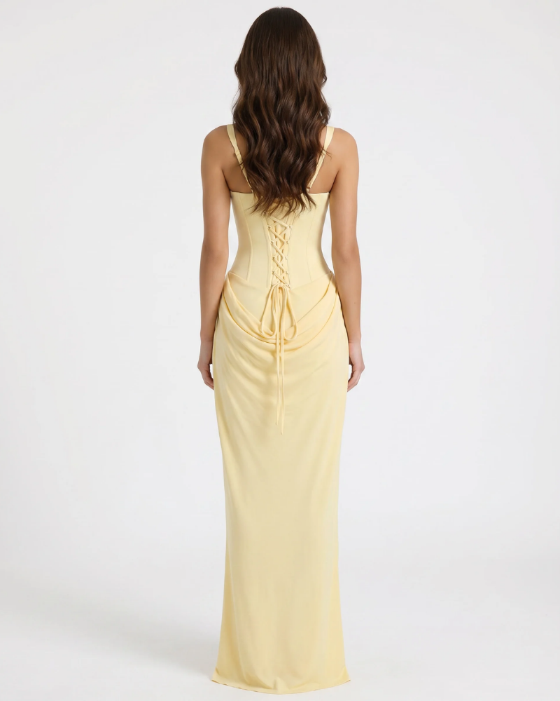 Back view yellow maxi dress with lace-up corset back, wide straps, and draped waist detail